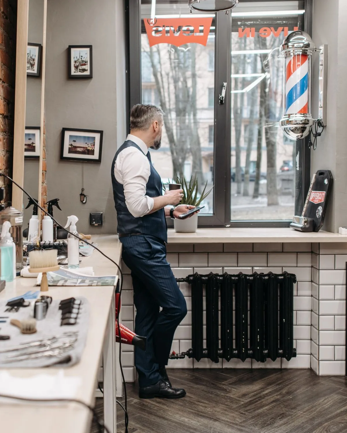 Barber at the bench by the front window