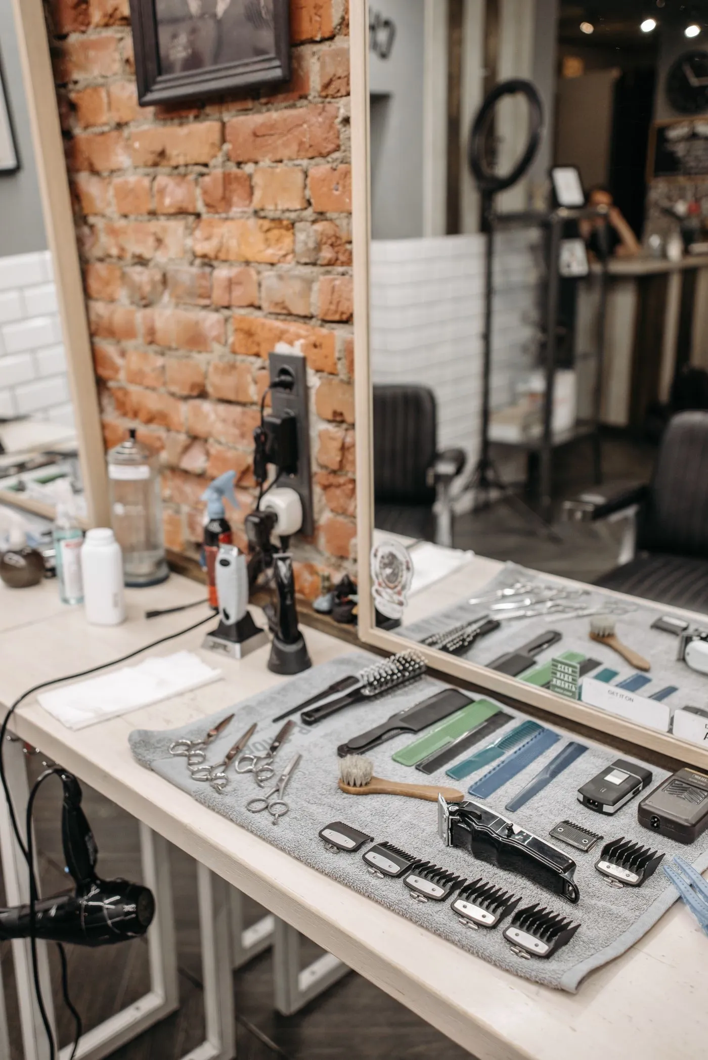 Combs, clippers and scissors along the barber's bench
